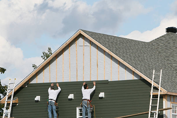 Professional Siding technician working in Port Jefferson, NY